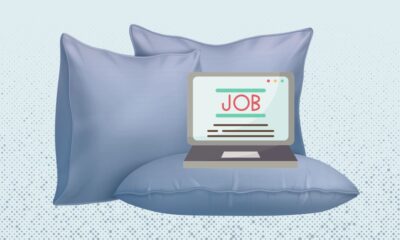 Graphic illustration of a laptop positioned on top of a pillow and surrounded by pillows